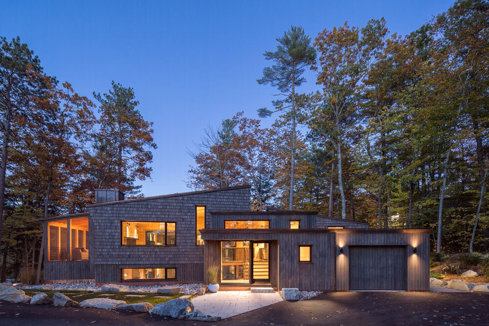 All the forms of the house and the detailed fenestration can be seen in this shot, which also showcases the abundance of windows in the public rooms. The bedrooms (on the right) are more private.