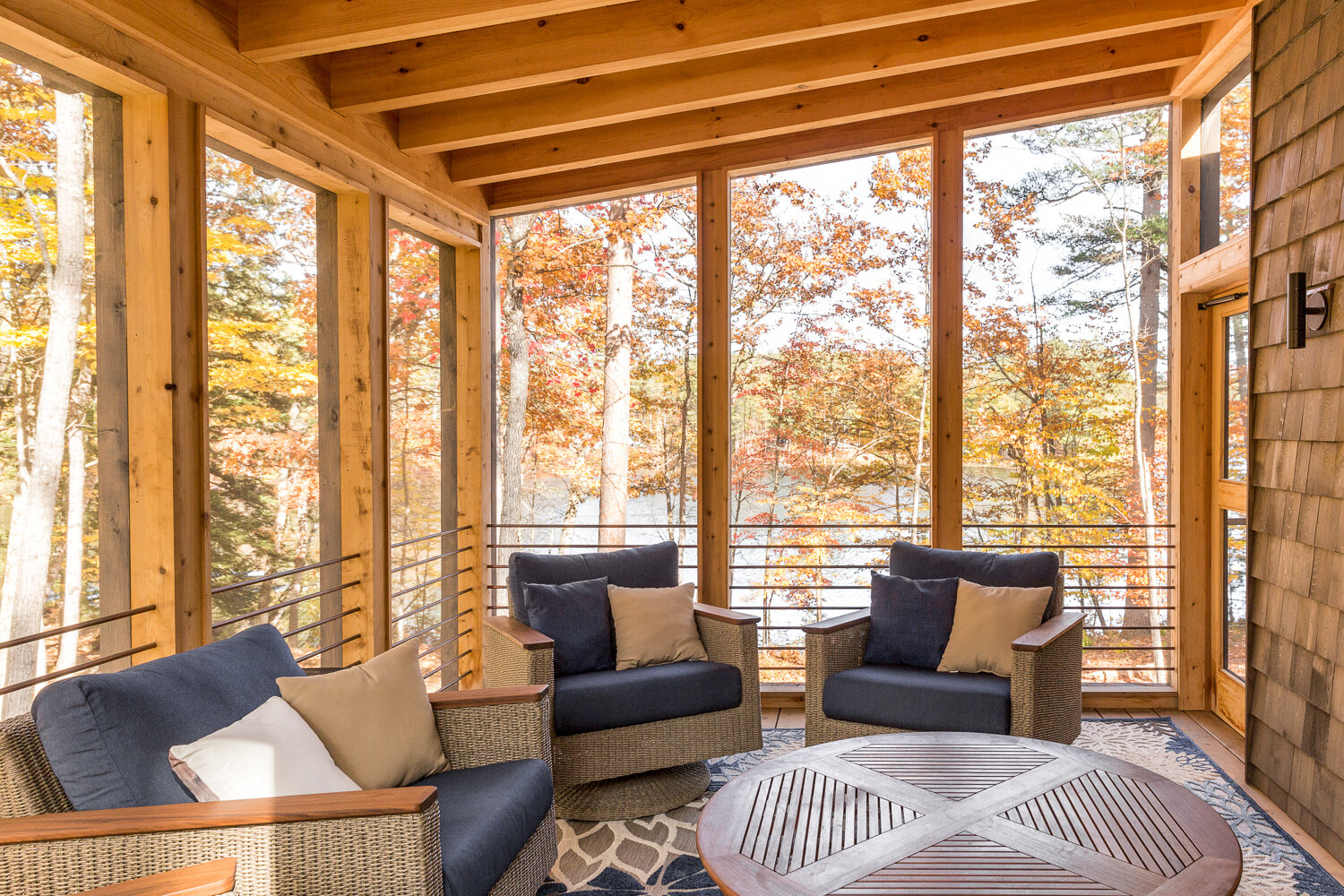  The screened porch with fireplace is the homeowners’ favorite place to be. 