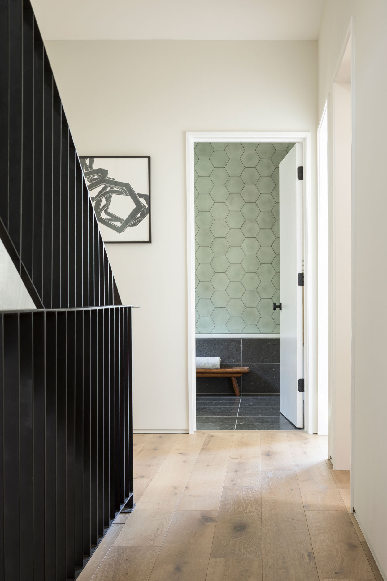 In the hall, a graphic print by Nicola Lopez.