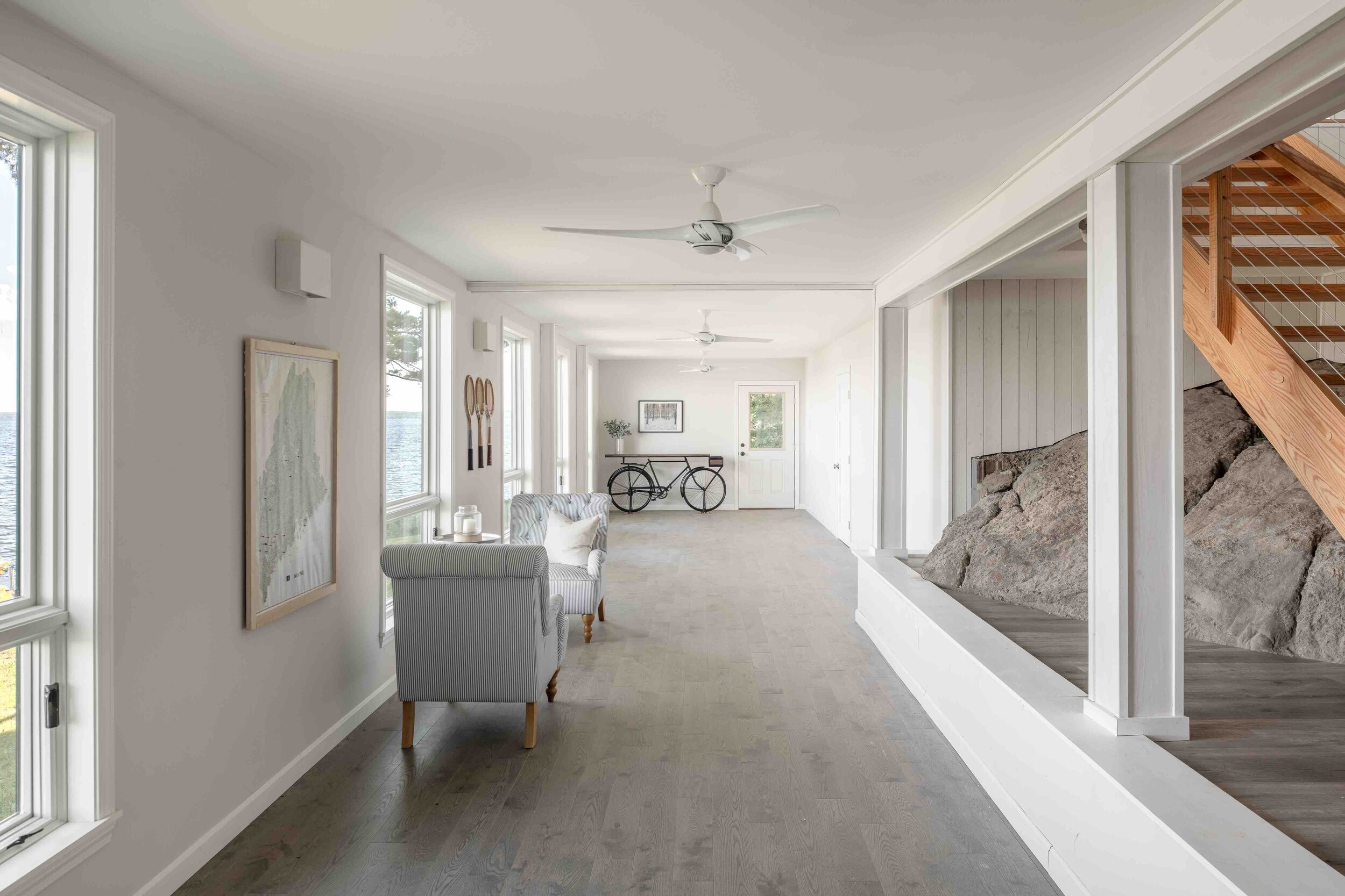  In the basement—once dark and windowless—elements of light and space were introduced to create a multipurpose lake room. 