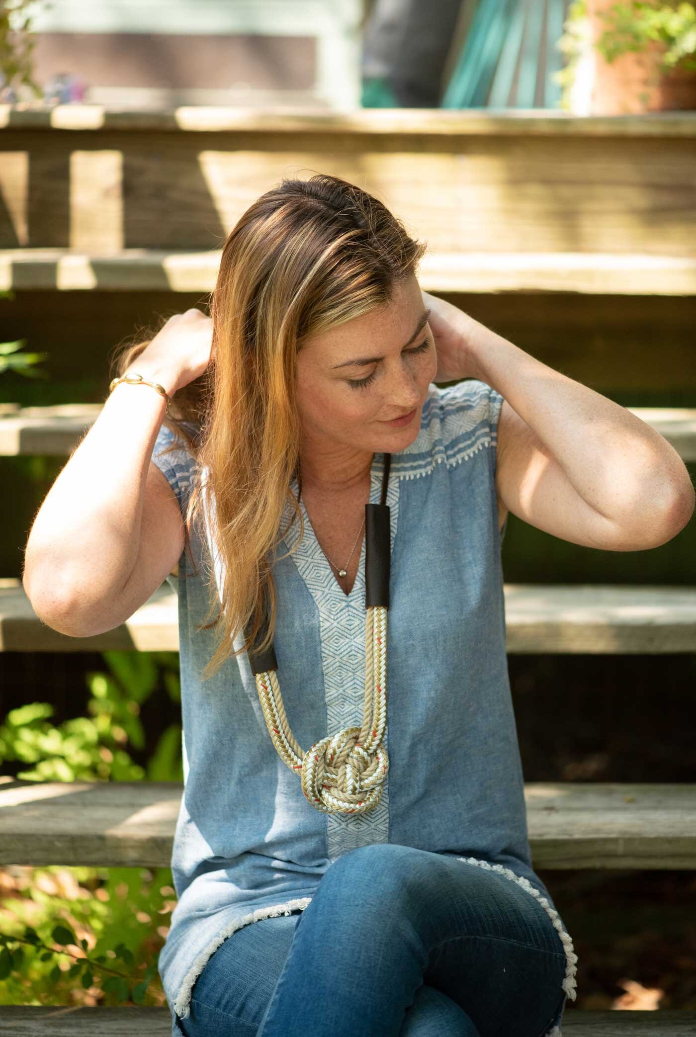  Becky McKinnell models a dock-line heart-knot rope necklace. 