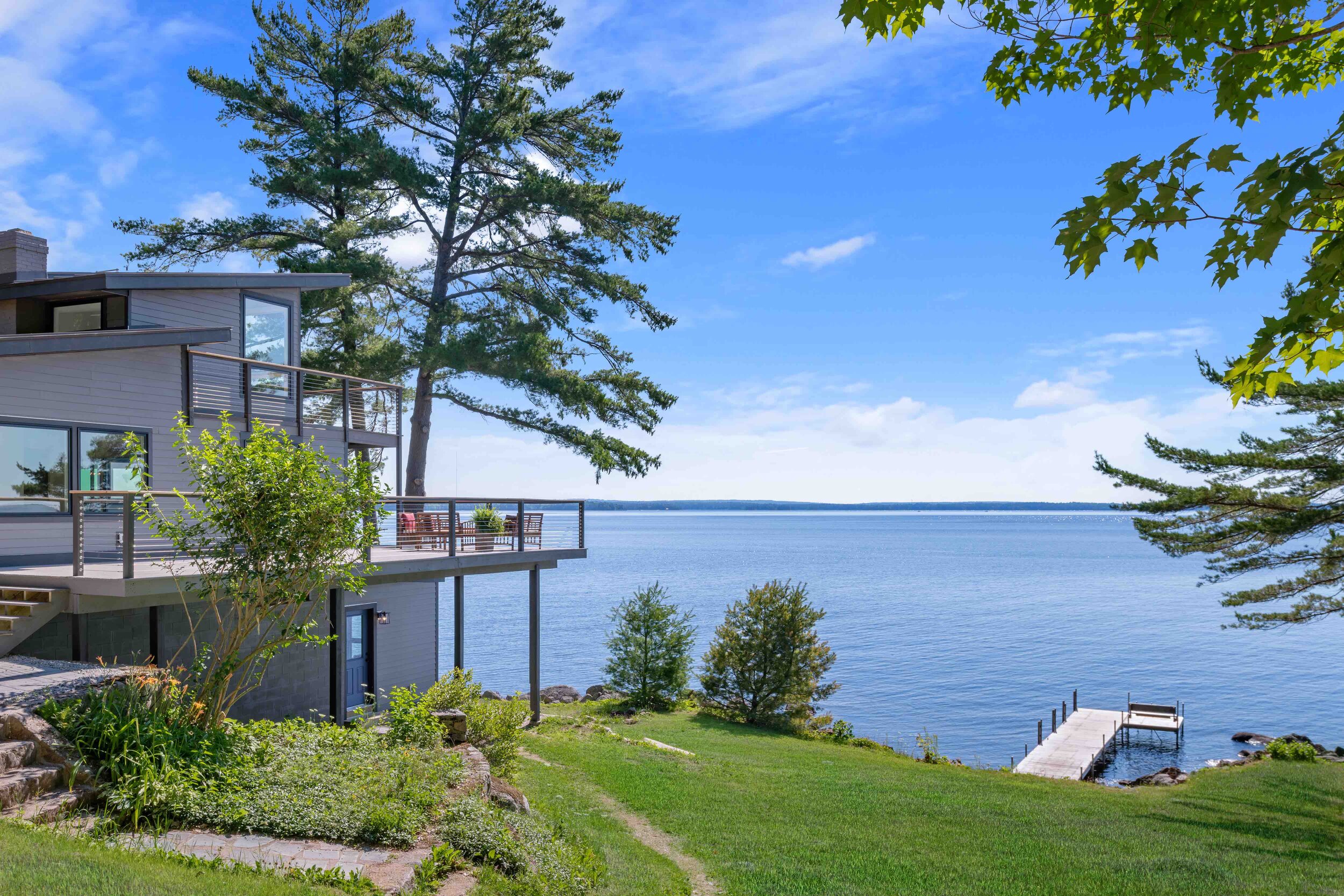 Evergreen Tree & Landscaping in Harrison crafted this oasis-like scene. The exterior is clad in Hardie board.