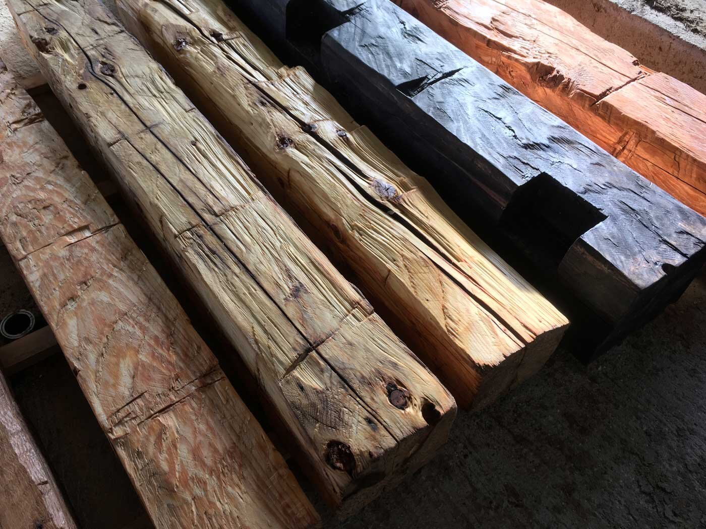  Stephen Smith hews fallen trees into the rough beams shown using just his axe. 